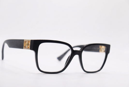 Black eyeglasses with gold temple details, front angle on a white background