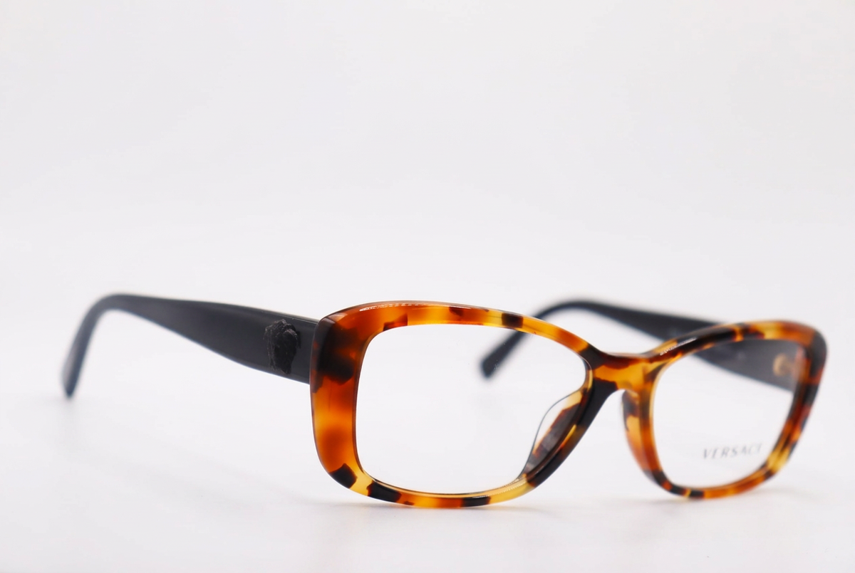 Tortoiseshell eyeglasses with black temples, front angle on white background