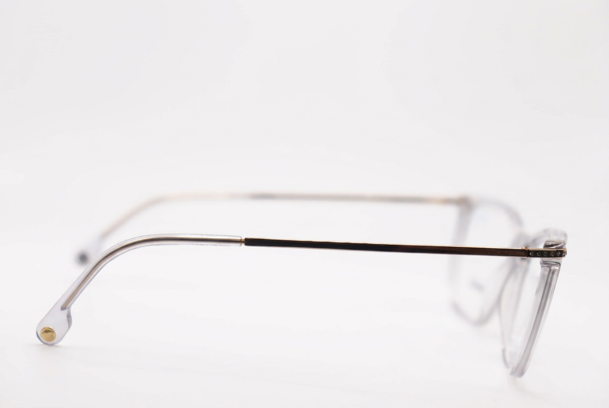Clear eyeglasses with slim metal temples, side view on a white background