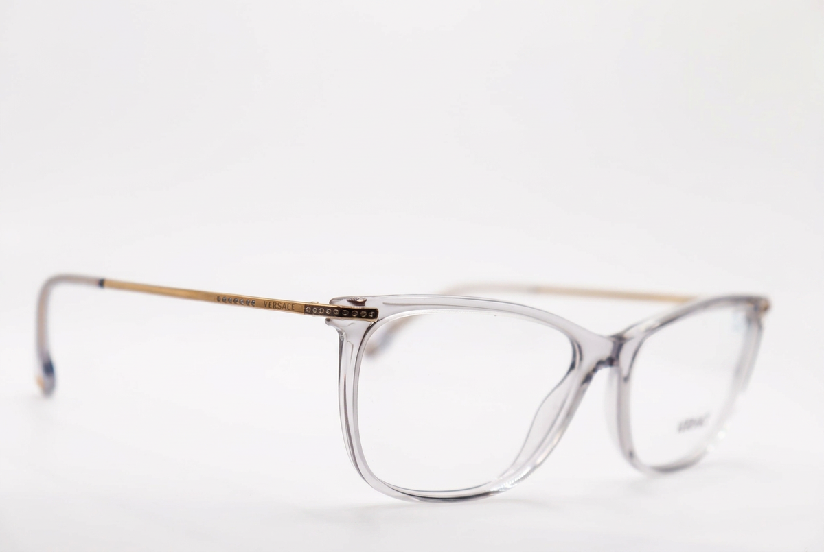 Clear eyeglasses with slim metal temples, front angle on a white background