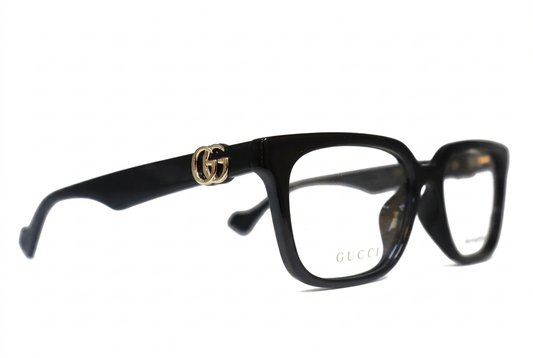 Black Gucci eyeglasses with gold GG emblem, front angle on white background